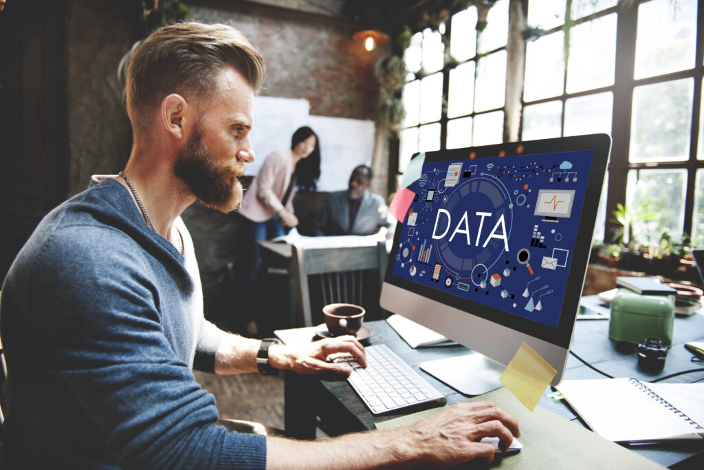 A man learning on his computer about data.